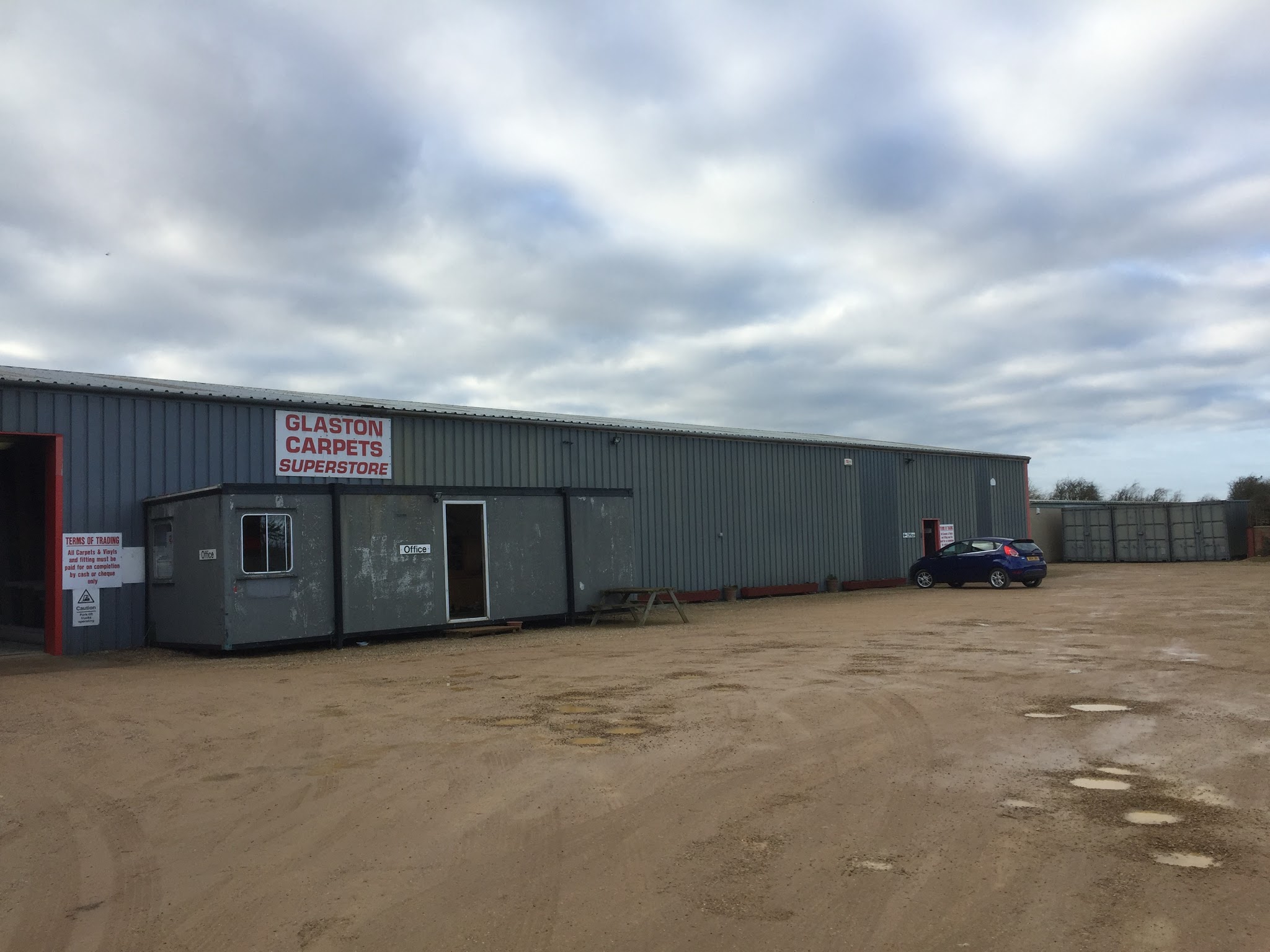 The Glaston Carpets Superstore warehouse and yard on Wing Road