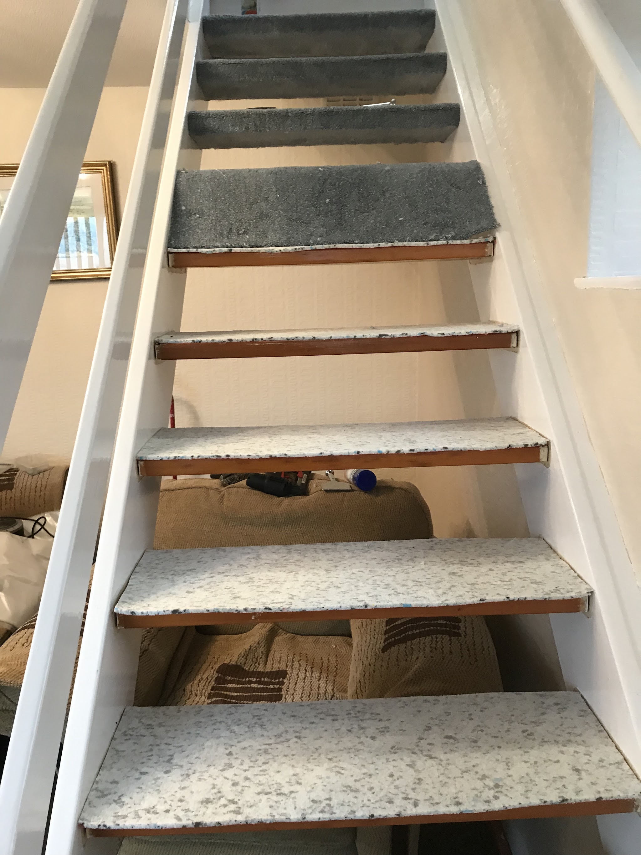 Carpeted treads on an open staircase